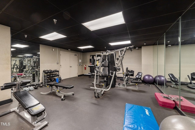 gym featuring a drop ceiling