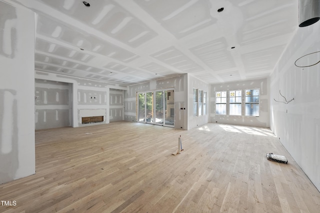 2957 Wexford Pond Way, Wake Forest, NC 27587 - unfurnished living room featuring wood finished floors