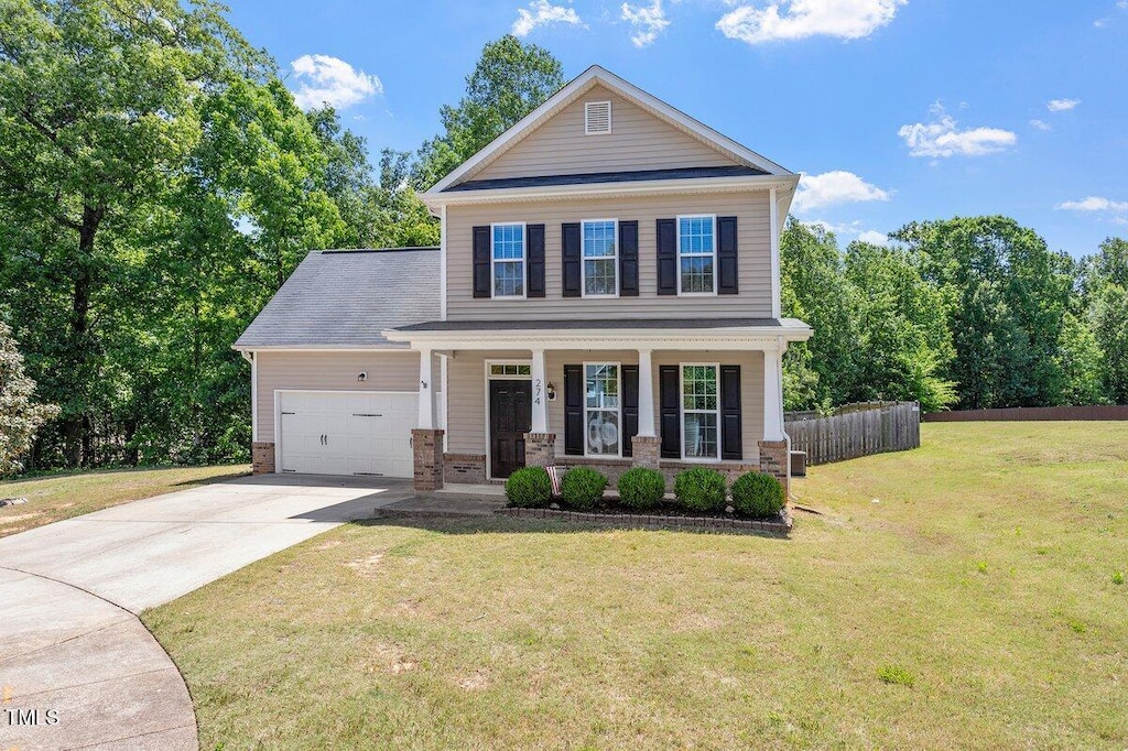 274 Tuscarora Ln, Clayton, NC 27520 - view of front of property with a porch, concrete driveway, and an attached garage