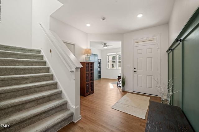 1417 Underbrush Dr, Durham, NC 27703 - foyer entrance featuring baseboards, wood finished floors, and stairs