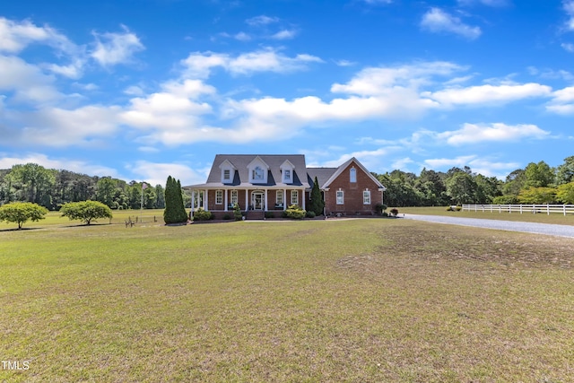 5595 Godwin Lake Rd, Benson, NC 27504 - new england style home with fence and a front yard