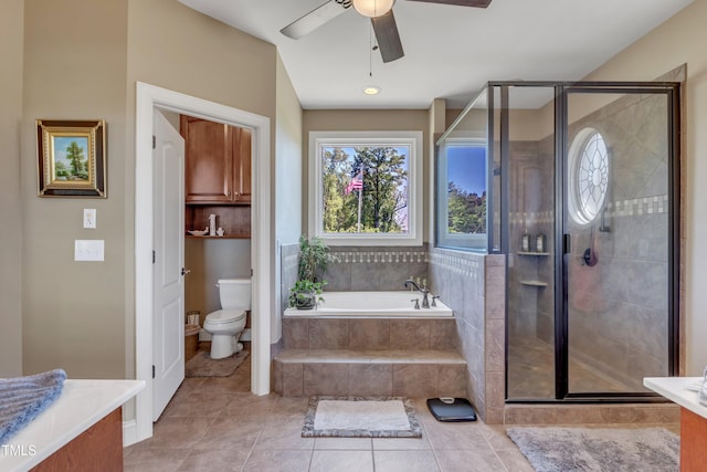 5595 Godwin Lake Rd, Benson, NC 27504 - bathroom featuring a garden tub, vanity, toilet, a shower stall, and a ceiling fan