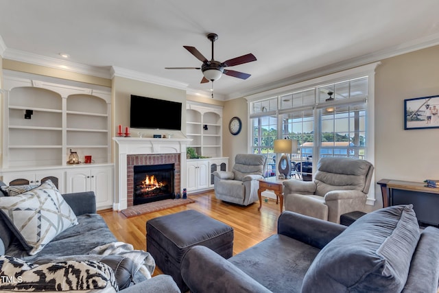 5595 Godwin Lake Rd, Benson, NC 27504 - living room with ornamental molding, a brick fireplace, ceiling fan, and light wood-style flooring