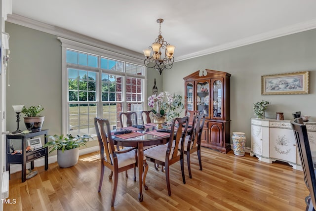 5595 Godwin Lake Rd, Benson, NC 27504 - dining room with an inviting chandelier, baseboards, crown molding, and light wood-type flooring