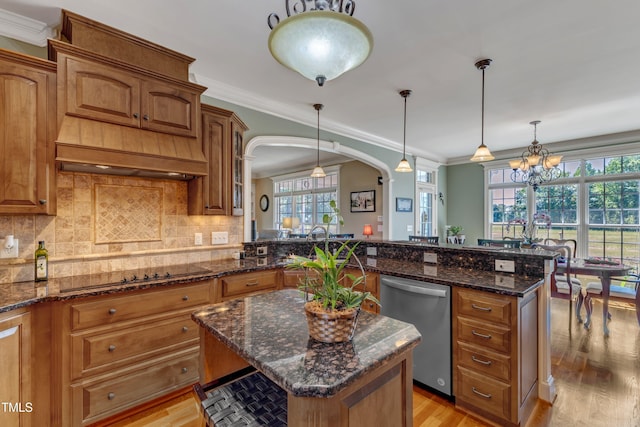 5595 Godwin Lake Rd, Benson, NC 27504 - kitchen with brown cabinetry, light wood-style flooring, and dishwasher