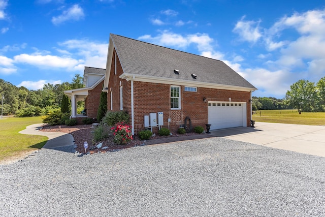 5595 Godwin Lake Rd, Benson, NC 27504 - view of home's exterior featuring a lawn, brick siding, a shingled roof, concrete driveway, and an attached garage