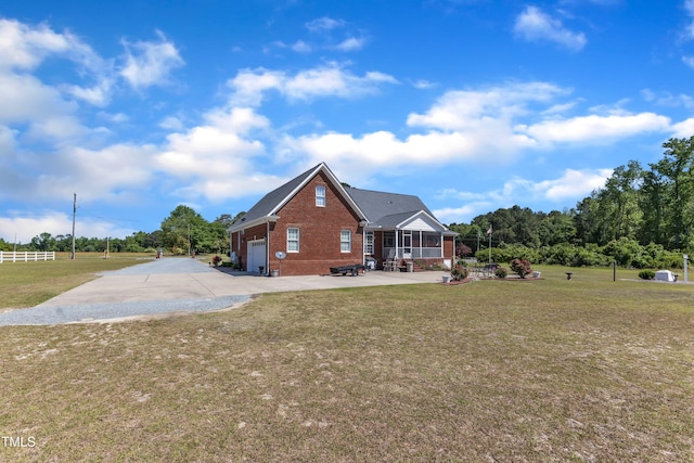 5595 Godwin Lake Rd, Benson, NC 27504 - exterior space featuring brick siding, a patio area, a yard, and concrete driveway