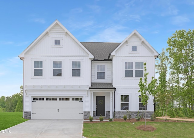 111 Silver Moon Ln Unit 121, Clayton, NC 27527 - view of front of house with a front yard, a shingled roof, and board and batten siding