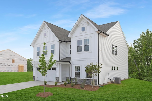 111 Silver Moon Ln Unit 121, Clayton, NC 27527 - view of front facade featuring concrete driveway, a shingled roof, central air condition unit, a front lawn, and a garage