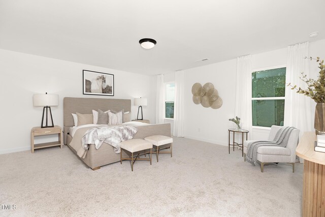 111 Silver Moon Ln Unit 121, Clayton, NC 27527 - carpeted bedroom featuring visible vents and baseboards