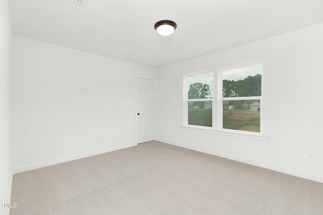 111 Silver Moon Ln Unit 121, Clayton, NC 27527 - empty room with baseboards and light colored carpet