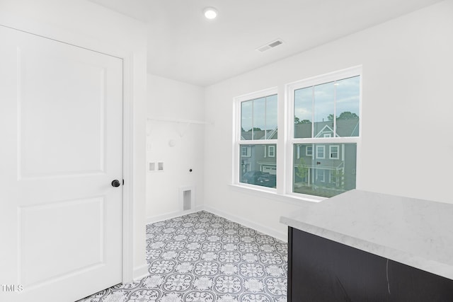 111 Silver Moon Ln Unit 121, Clayton, NC 27527 - washroom featuring hookup for an electric dryer, visible vents, baseboards, hookup for a washing machine, and laundry area