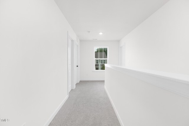 111 Silver Moon Ln Unit 121, Clayton, NC 27527 - hallway featuring light colored carpet, recessed lighting, and baseboards