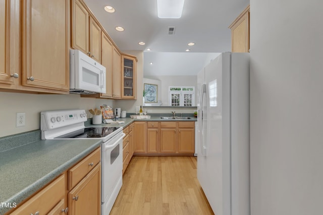 9005 River Estates Dr, Knightdale, NC 27545 - kitchen featuring visible vents, white appliances, glass insert cabinets, light wood-type flooring, and a sink
