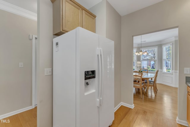 9005 River Estates Dr, Knightdale, NC 27545 - kitchen featuring crown molding, white fridge with ice dispenser, and light wood-type flooring