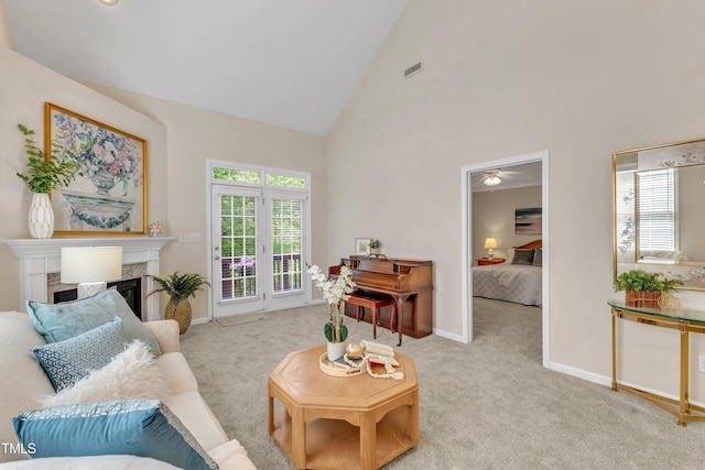 9005 River Estates Dr, Knightdale, NC 27545 - living room featuring visible vents, carpet flooring, a fireplace, and high vaulted ceiling