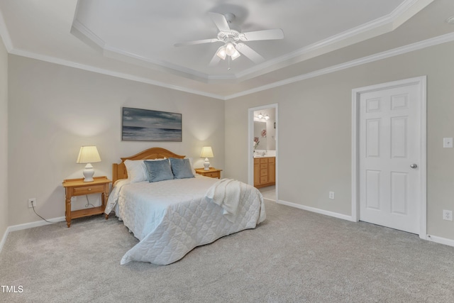 9005 River Estates Dr, Knightdale, NC 27545 - carpeted bedroom with crown molding, ceiling fan, ensuite bath, baseboards, and a tray ceiling