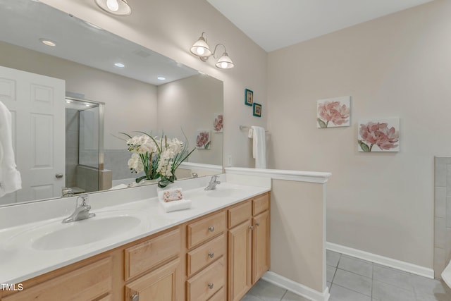 9005 River Estates Dr, Knightdale, NC 27545 - bathroom with double vanity, a shower with door, a sink, and tile patterned flooring