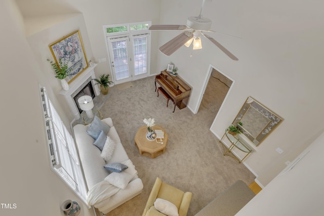 9005 River Estates Dr, Knightdale, NC 27545 - carpeted living area with a fireplace and a ceiling fan