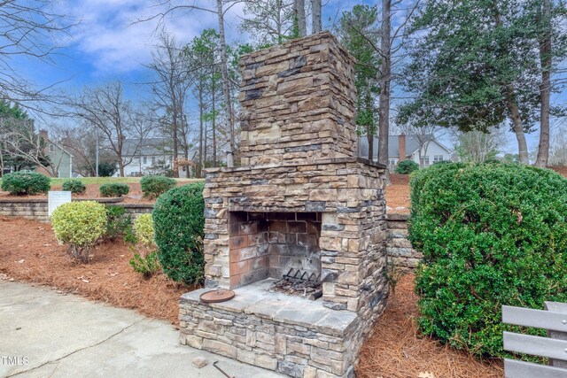 9005 River Estates Dr, Knightdale, NC 27545 - view of patio with an outdoor stone fireplace