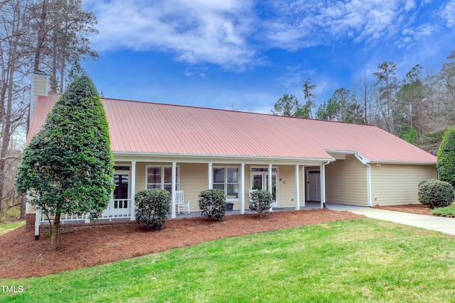 9005 River Estates Dr, Knightdale, NC 27545 - view of front of property with covered porch, driveway, metal roof, and a front yard