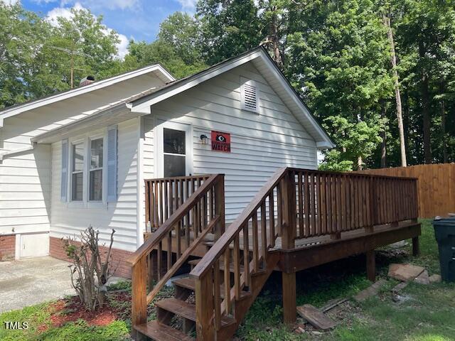 906 Camden Ave, Durham, NC 27701 - rear view of house featuring a deck and crawl space
