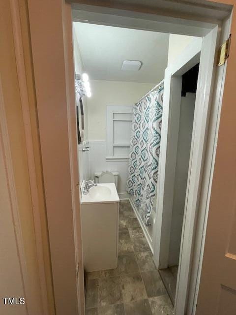 906 Camden Ave, Durham, NC 27701 - full bathroom featuring vanity, curtained shower, and stone finish floors
