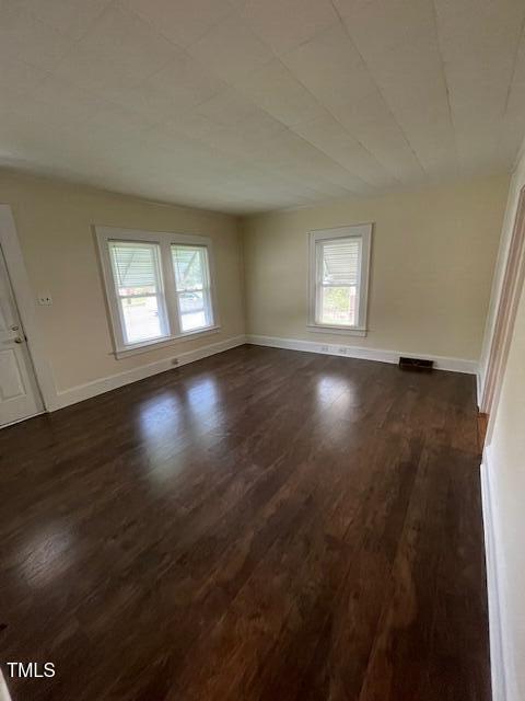 906 Camden Ave, Durham, NC 27701 - spare room with plenty of natural light and dark wood-type flooring