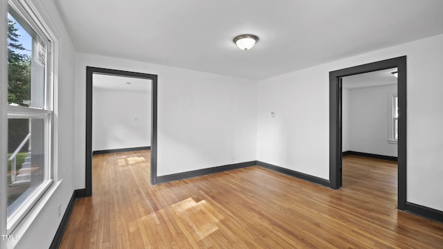 114 Barnhill St, Durham, NC 27707 - spare room featuring light wood-style flooring and baseboards