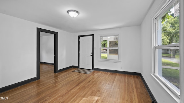 114 Barnhill St, Durham, NC 27707 - empty room featuring healthy amount of natural light and wood finished floors