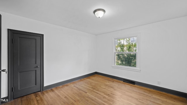 114 Barnhill St, Durham, NC 27707 - empty room featuring wood finished floors and baseboards