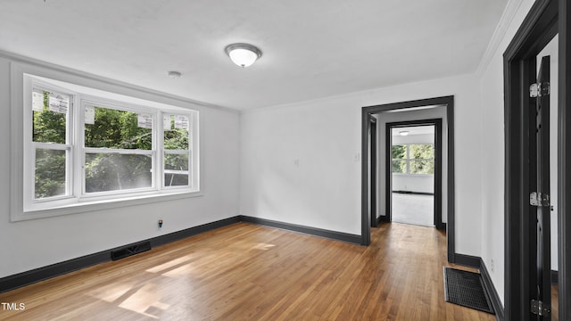 114 Barnhill St, Durham, NC 27707 - empty room with light wood finished floors and baseboards