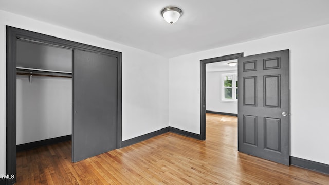 114 Barnhill St, Durham, NC 27707 - unfurnished bedroom featuring a closet and light wood-type flooring