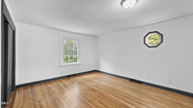114 Barnhill St, Durham, NC 27707 - empty room featuring hardwood / wood-style floors and baseboards