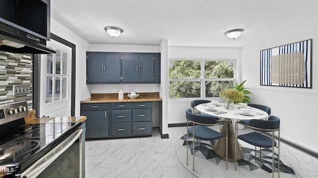 114 Barnhill St, Durham, NC 27707 - kitchen featuring stainless steel appliances and light marble finish floors