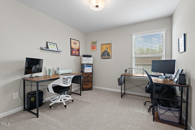 carpeted office space with baseboards