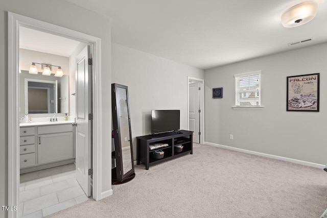 living room featuring visible vents, baseboards, and light colored carpet