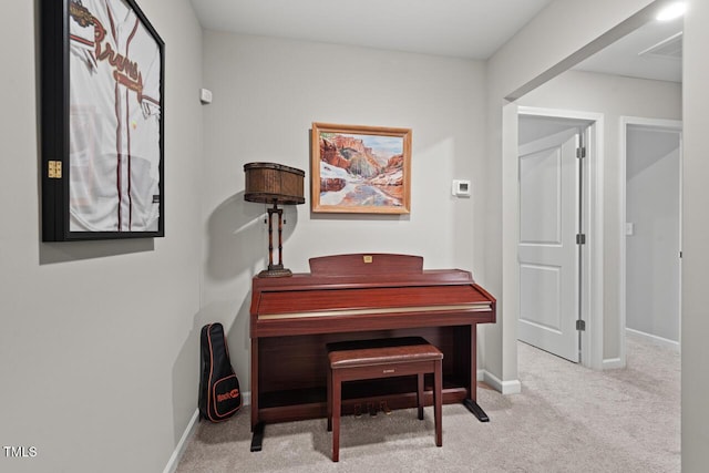 living area with carpet flooring and baseboards
