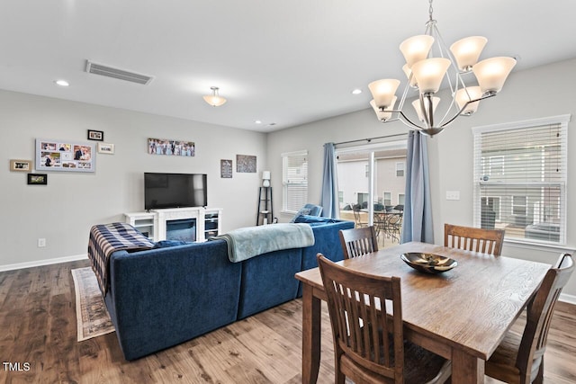 dining area featuring wood finished floors, baseboards, visible vents, and recessed lighting