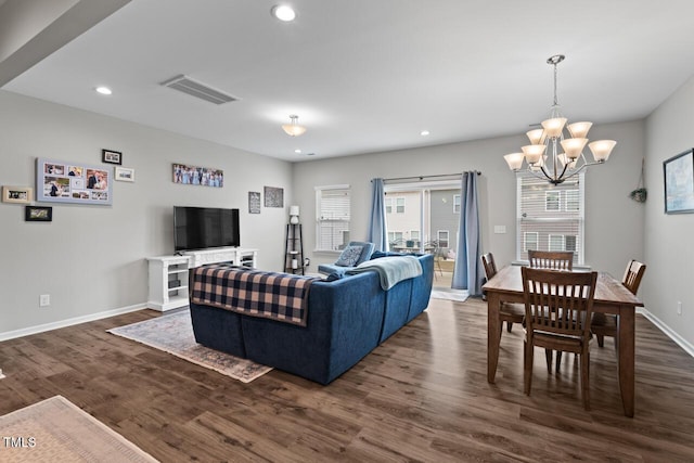 living area with baseboards, a chandelier, recessed lighting, dark wood-style floors, and visible vents