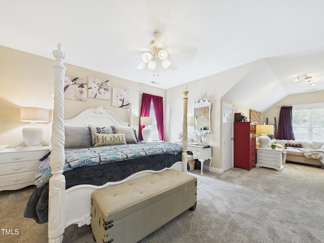 bedroom featuring carpet floors, lofted ceiling, baseboards, and a ceiling fan