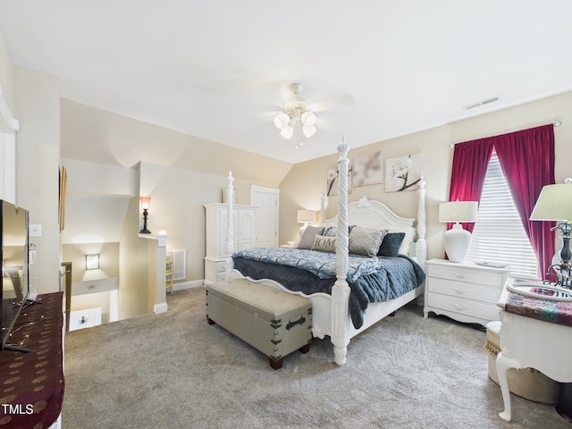 carpeted bedroom with visible vents and ceiling fan