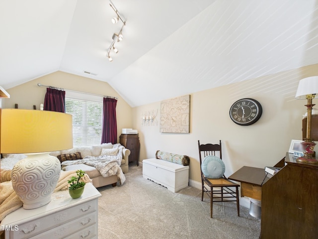 living room with vaulted ceiling, visible vents, carpet, and rail lighting