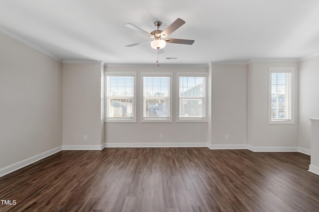 spare room featuring baseboards, visible vents, dark wood-type flooring, and a ceiling fan