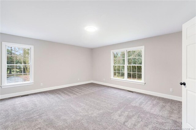 1429 Pocosin Rd, Winterville, NC 28590 - empty room with baseboards, visible vents, and carpet flooring