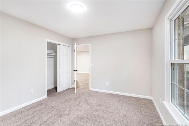 1429 Pocosin Rd, Winterville, NC 28590 - unfurnished bedroom with baseboards, a closet, and carpet