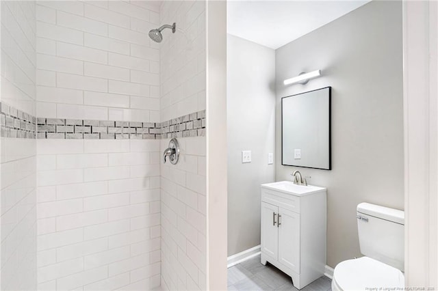 1429 Pocosin Rd, Winterville, NC 28590 - bathroom with baseboards, a tile shower, toilet, and vanity