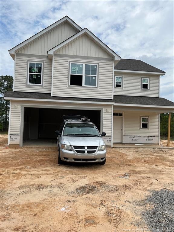 228 Dove Rd, Cameron, NC 28326 - view of front of house with an attached garage, a shingled roof, and driveway