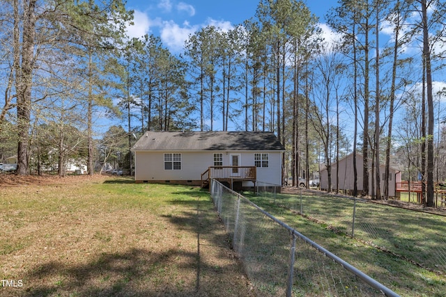 view of front of home with fence, a front lawn, crawl space, and a deck