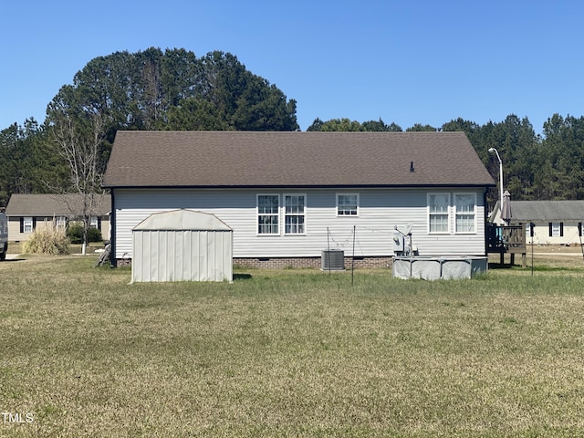 176 Clear Water Dr, Smithfield, NC 27577 - rear view of house with a yard, crawl space, and central AC unit